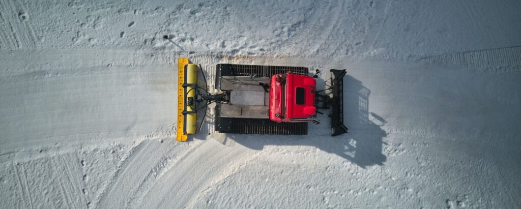 birds eye view of a snow plowing machine