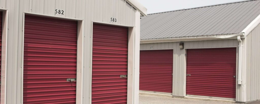 a view of storage units with red doors