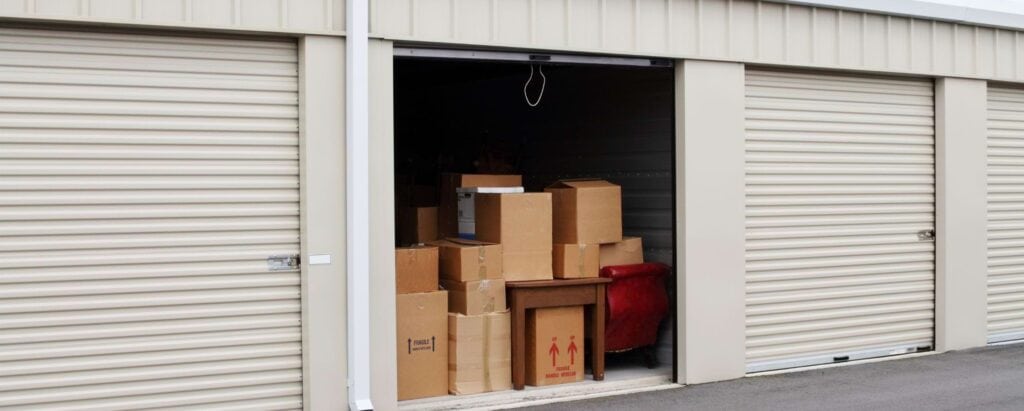 an open storage unit with boxes inside