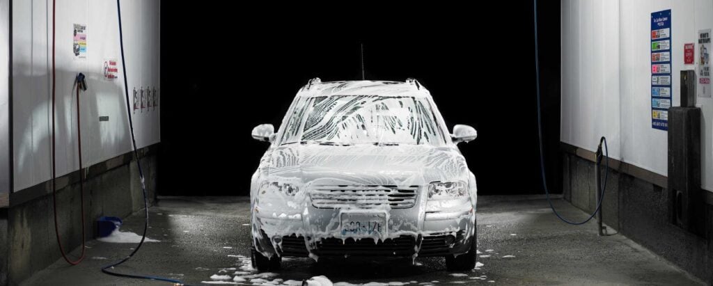 a soaped up car in a car wash