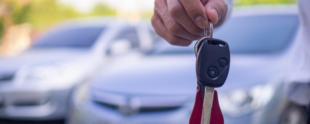 a person holding car keys