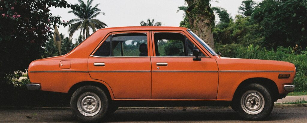 a parked old red car