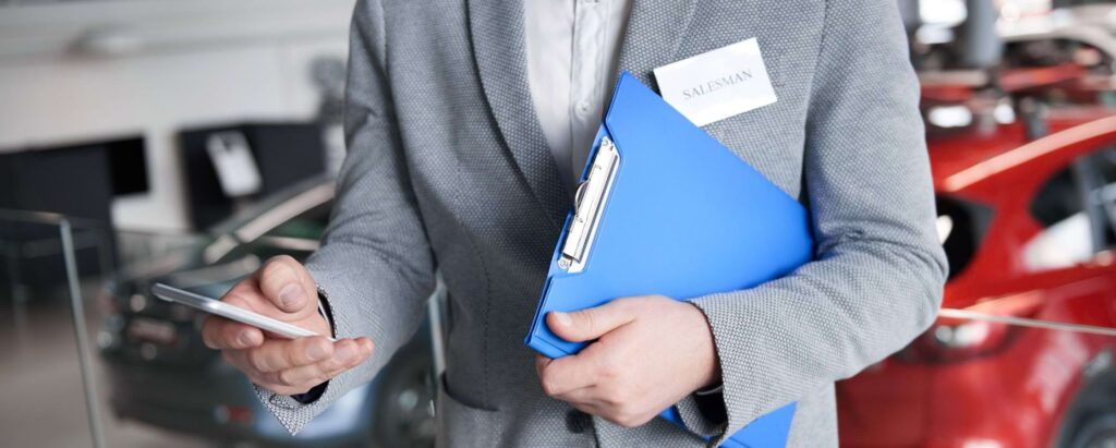 a salesperson holding a phone