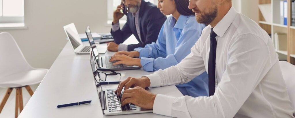 data analysts working on laptops