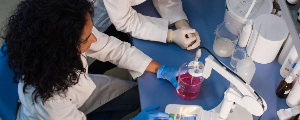 a woman working with her colleague in a major chemicals company