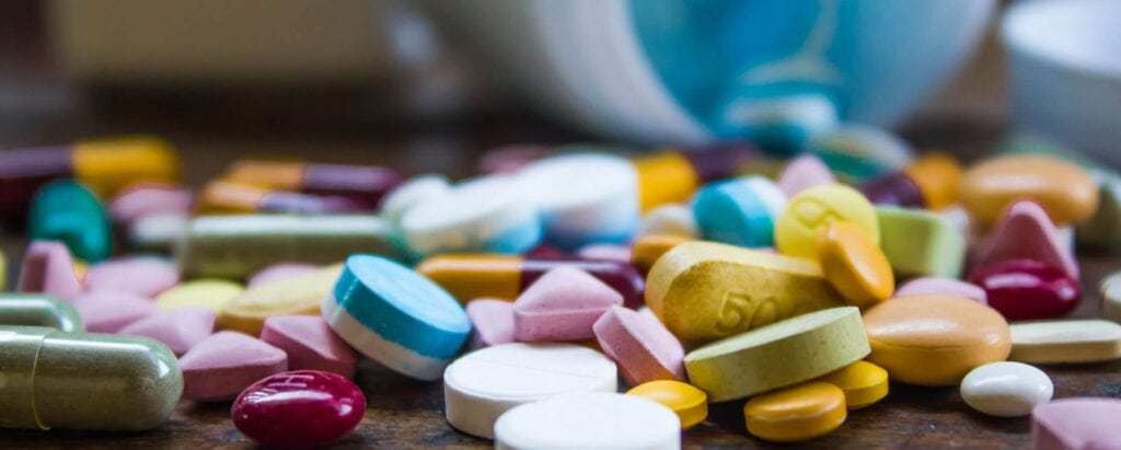 various colorful pills on a table