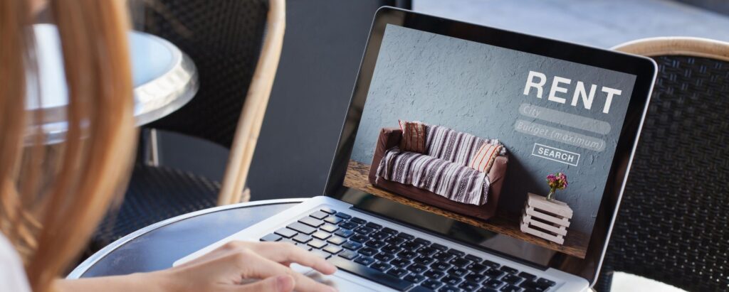 a woman searching the things to rent online