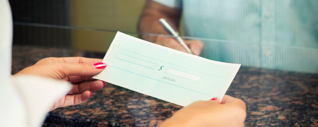 A person receiving a check in a bank