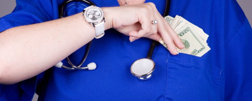 Nurse putting money in her pocket