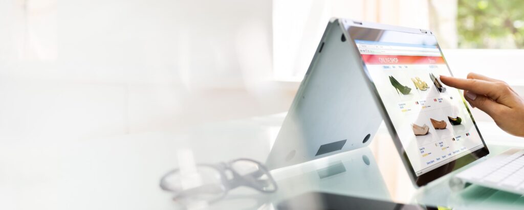 A person is searching the online shop website on a tablet screen