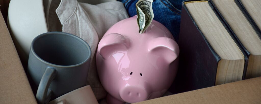 Piggy bank in a box with other items