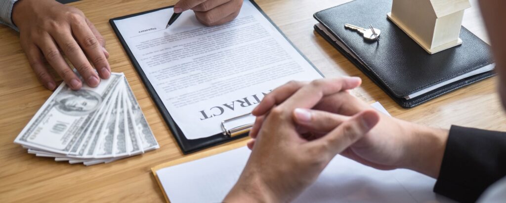 A person is signing a loan contract